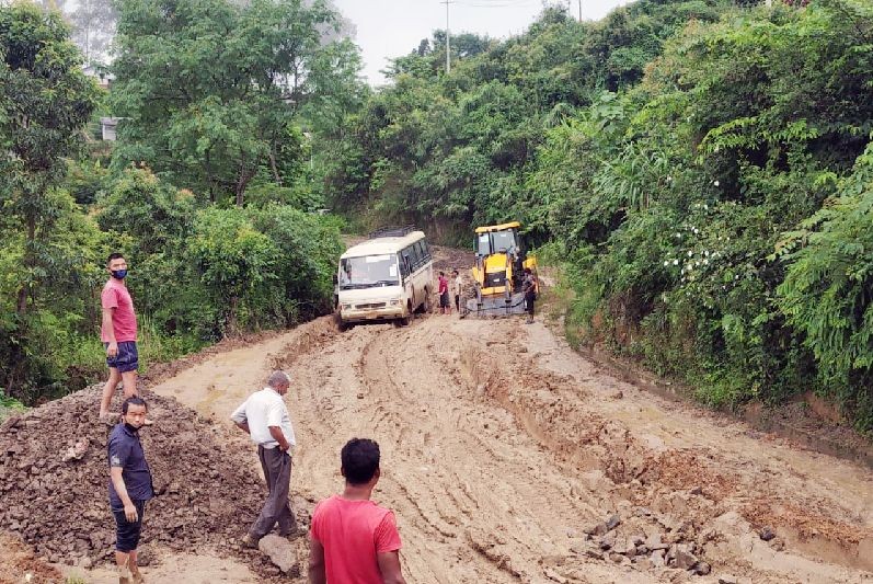 Vehicles face tough time to pass through dilapidated road condition of National Highway below BSF Camp, Kohima on July 21. Seyie Auto, Kohima contributed stones for temporary repairing of this stretch.